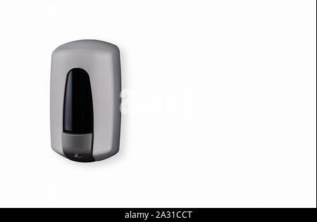 Metal grey liquid hand soap dispenser small mounted on wall refillable Stock Photo