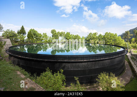 Water Storage Tank for the community of Ayubia, Donga Gali, Pakistan. Stock Photo