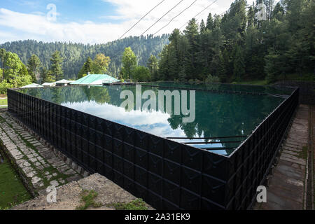 Water Storage Tank for the community of Ayubia, Donga Gali, Pakistan. Stock Photo