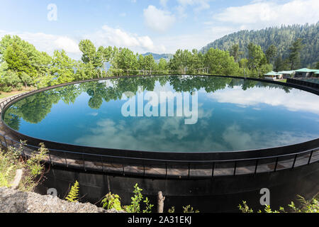 Water Storage Tank for the community of Ayubia, Donga Gali, Pakistan. Stock Photo