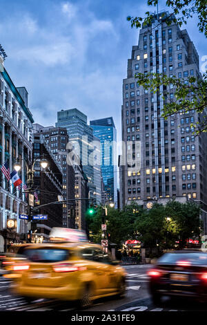 New York City yellow cabs rushing along at dawn in downtown Manhattan, USA. Stock Photo