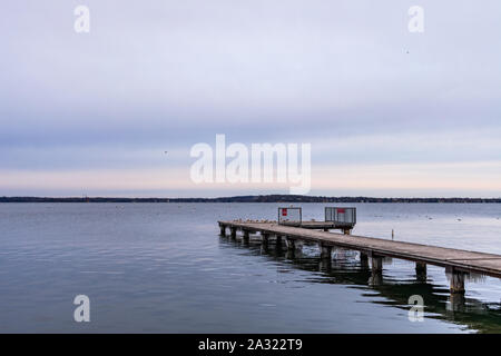 Side View of a Pier Extending out towards Lake Mendota in Madison Wisconsin Stock Photo