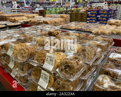 Orlando,FL/USA -10/4/19:  Chocolate chip and various other kinds of cookies on the baked goods aisle of a Sams Club grocery store with fresh fruits an Stock Photo