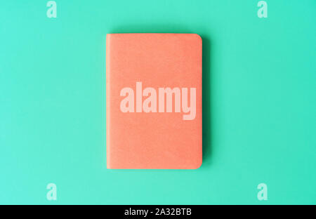 Orange diary for 2020 on a mint background. New Year concept in trendy colors. Stock Photo