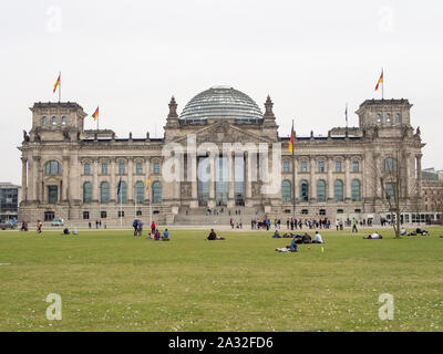 BERLIN, GERMANY - APRIL 4, 2016: Tourists In Front of Berlin Reichstag, Home of The German Parliament Bundestag Stock Photo