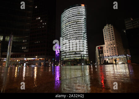 Berlin, Germany. 04th Oct, 2019. The DB Tower (M) and the Ritz Carlton are reflected in the rain puddles on Potsdamer Platz. (long exposure) Credit: Annette Riedl/dpa/Alamy Live News Stock Photo
