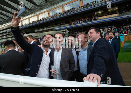 Autumn Racing Weekend & Ascot Beer Festival, Ascot Racecourse, Ascot, Berkshire, UK. 4th October, 2019. Selfie time for these men at the races. Credit: Maureen McLean/Alamy Stock Photo