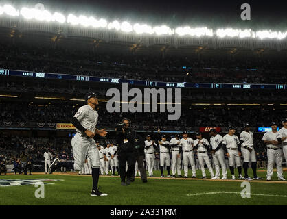 Bronx, USA. 04th Oct, 2019. New York Yankees right fielder Aaron Judge (L) is introduced during opening ceremonies for the 2019 MLB Playoffs American League Division Series Game 1 with the Minnesota Twins at Yankee Stadium in New York City on October 4, 2019. Photo by Ray Stubblebine/UPI Credit: UPI/Alamy Live News Stock Photo