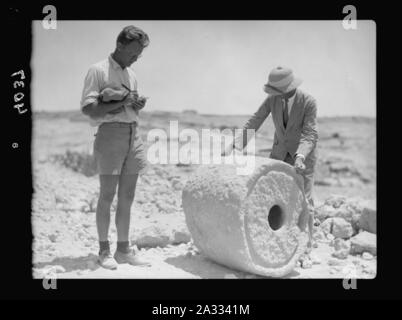 Excavations. Tell Beit Mirsim, (Kirjath Sepher). Excavators measuring an ancient dye vat, 1000 B.C. Stock Photo