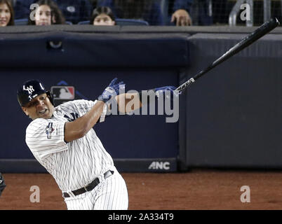 Bronx, USA. 04th Oct, 2019. New York Yankees Edwin Encarnacion hits an RBI double in the 3rd inning against the Minnesota Twins in game one of the American League Division Series at Yankee Stadium on Friday, October 4, 2019 in New York City. Photo by John Angelillo/UPI Credit: UPI/Alamy Live News Stock Photo