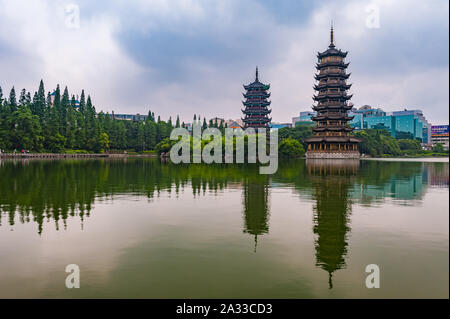 Guilin, China, 17 Jun 2014: Popular tourist attraction Sun and Moon Pagodas in Guilin. Stock Photo