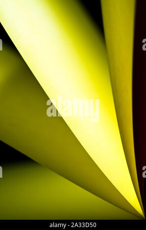 bright yellow colored illuminated notepad in various position and ...