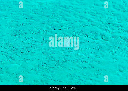 Sand blured background and wallpaper colored in aquamarine, textured pattern - Image Stock Photo