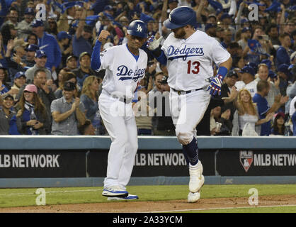 July 19, 2019: Los Angeles Dodgers manager Dave Roberts (30) and Los  Angeles Dodgers third base coach Dino Ebel (12) pose for a photo before the  game between the Miami Marlins and