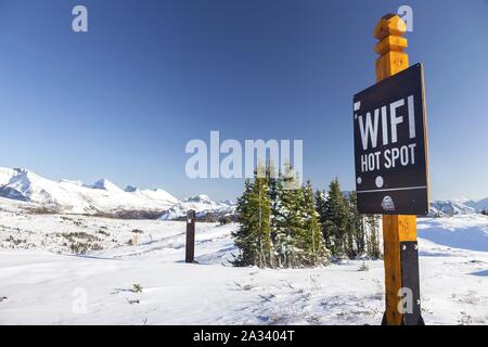 Public WiFi or Wireless Technology Hot Spot Table Sign in Sunshine Meadows Mountain Ski Area, Banff National Park Alberta Canada Stock Photo