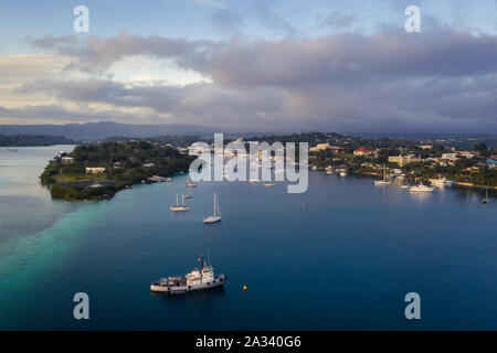 Nightfall over the Port Vila harbor with sailboat and other yachts in Vanuatu capital city of this south Pacific nation Stock Photo