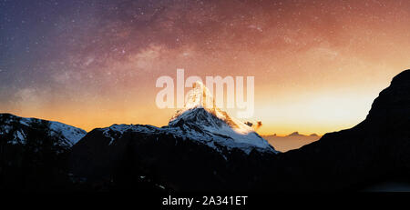 Swiss Alps, Panoramic Matterhorn mountain in sunrise with starry sky in dawn Stock Photo