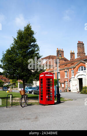 iconic old cast iron type K6 red public telephone box designed to commemorate the silver jubilee of King George V Stock Photo