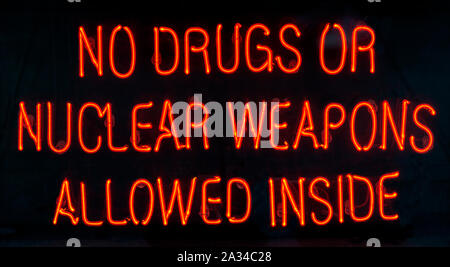 Dublin. Ireland. 06.26.16. Red Neon Sign in the window of a bar in Dublin, Ireland - No Drugs or Nuclear Weapons Allowed Inside. Stock Photo