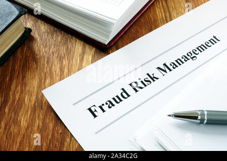 Documents about Fraud risk management and pen. Stock Photo