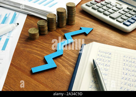 Growth business success with blue arrow and financial report. Stock Photo