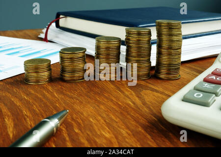Increasing stacks of coins. Financial and business savings growth concept. Stock Photo