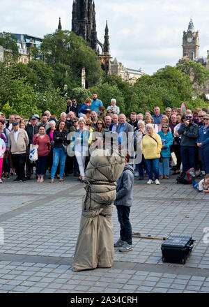 Escapology street act during the Edinburgh Fringe Festival.