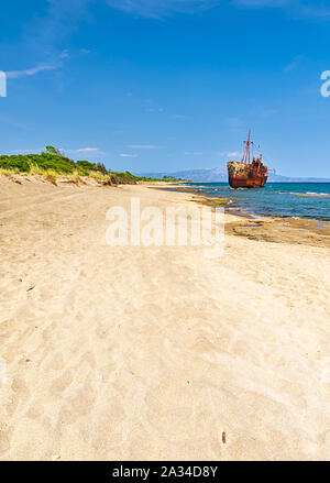 Rusty big ship 'Dimitrios'  shipwreck on Selinitsa beach under a deep blue sky at Gytheio in Peloponnese Greece. Stock Photo