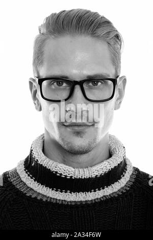 Face of young handsome man wearing eyeglasses Stock Photo