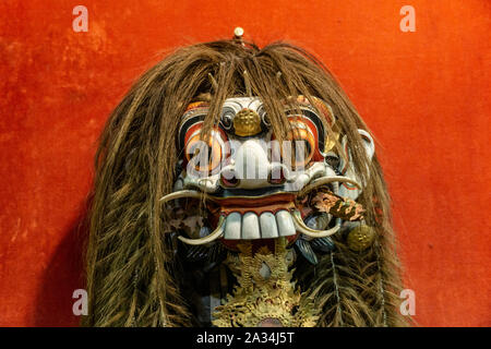 rangda witch mask in bali red background Stock Photo