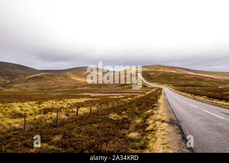 A scenic road through highlands during autumn near Lecht Ski Centre in Cairngorms National park, Scotland, Scotland Stock Photo