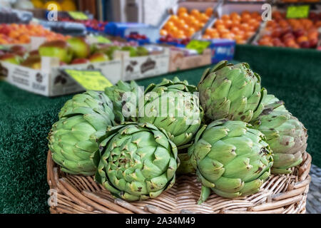 Close up view of green artichokes with selective focus Stock Photo