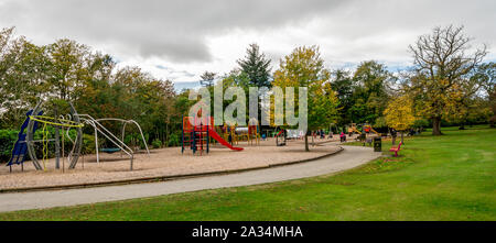 Large children playground area with slides, bars, swings and other equipment in Hazlehead park, Aberdeen, Scotland Stock Photo