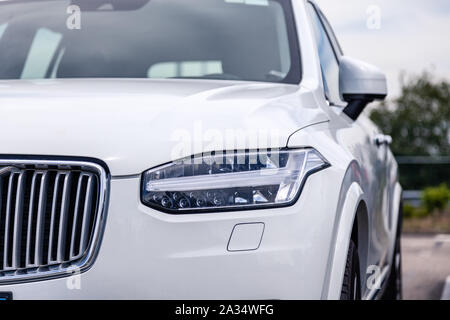 France Lyon 2019-06-18 closeup front part of car, bumper of sedan premium white Volvo XC90 with EU licence plate on parking european town. Concept lux Stock Photo