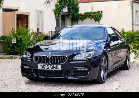 France Lyon 2019-06-18 closeup luxury dark blue German car sedan premium BMW 6 series with EU registration number on parking european town. Concept sl Stock Photo