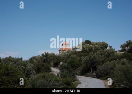 Traditional Church atop a rocky summit, Filia, Lesbos, Greece. Stock Photo