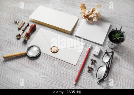 Vintage stationery set on light wood table background. Branding mock-up. Stock Photo