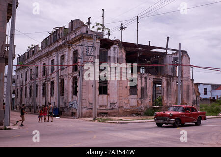 Derelict buildings and classic cars are commonplace in Cuba Stock Photo