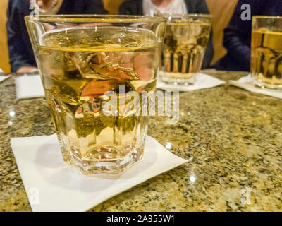 Glasses of ginger ale on table Stock Photo