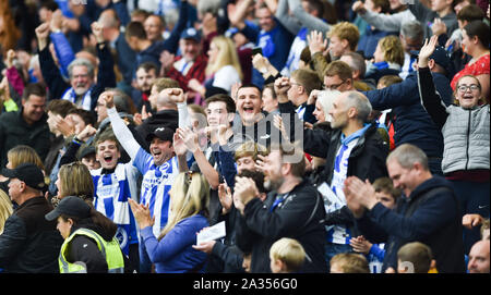 Brighton UK 5th October 2019 -  Brighton fans celebrate during the Premier League match between  Brighton and Hove Albion and Tottenham Hotspur at the Amex Stadium - Editorial use only. No merchandising. For Football images FA and Premier League restrictions apply inc. no internet/mobile usage without FAPL license - for details contact Football Dataco  : Credit Simon Dack TPI / Alamy Live News Stock Photo