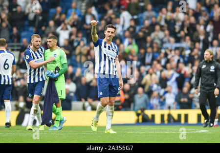 Brighton UK 5th October -  Lewis Dunk of Brighton celebrates after the 3-0 win during the Premier League match between  Brighton and Hove Albion and Tottenham Hotspur at the Amex Stadium - Editorial use only. No merchandising. For Football images FA and Premier League restrictions apply inc. no internet/mobile usage without FAPL license - for details contact Football Dataco  : Credit Simon Dack TPI / Alamy Live News