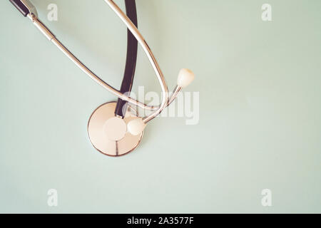 The black stethoscope on a turquoise background Stock Photo
