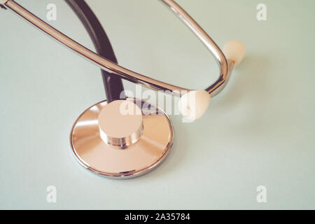 The black stethoscope on a turquoise background Stock Photo