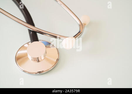 The black stethoscope on a turquoise background Stock Photo