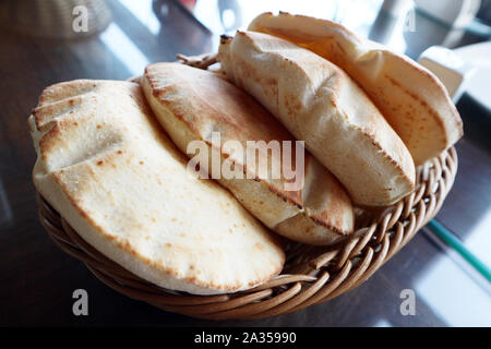 Basket of Arabic bread/Pita bread/Lebanese bread: basket of freshly baked Lebanese pita bread Stock Photo
