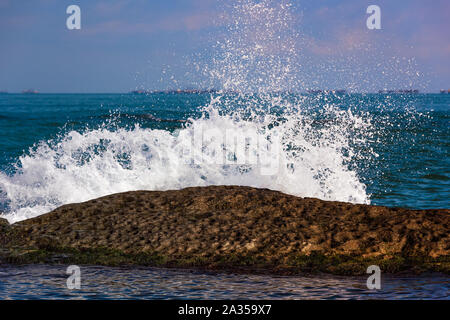 Waves breaking on reef, big splashes Stock Photo
