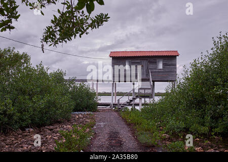 An elevated fisherman's hut on the Caribbean island of Utila in Honduras Stock Photo