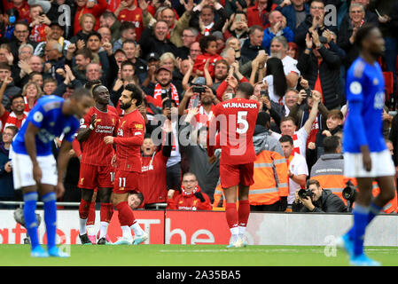 Liverpool's Sadio Mane (second left) celebrates scoring his sides first goal of the game with Mohamed Salah during the Premier League match at Anfield, Liverpool. Stock Photo