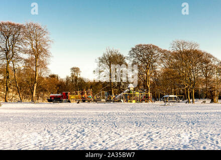 Large children playground covered by snow in Seaton Park, Aberdeen, Scotland Stock Photo