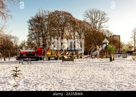 Various playground equipment outside in winter time in Seaton Park, Aberdeen, Scotland Stock Photo